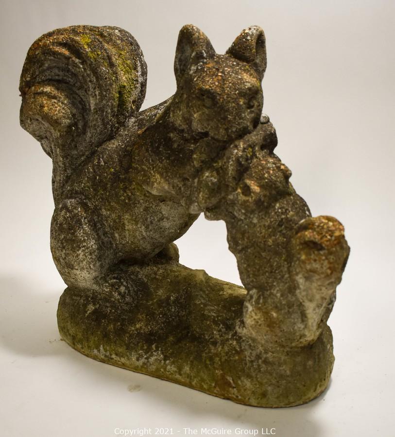 cement squirrel statue